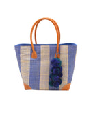 Bora Bora Denim Two Tone Stripes Straw Basket Bag with Waterfall Pompoms Charm Embellishment handmade loomed natural raffia palm fiber in a multicolor horizontal stripe pattern of even width wide bands of denim retro/light/blue and natural straw color with leather handles and feet plus matching waterfall pompom charm embellishment handbag beach bag - Shebobo