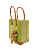 Side view Bora Bora Midori Two Tone Stripes Straw Basket Bag with Waterfall Pompoms Charm Embellishment handmade loomed natural raffia palm fiber in a multicolor horizontal stripe pattern of even width wide bands of midori lime/neon/bright/green and natural straw color with leather handles and feet plus matching waterfall pompom charm embellishment handbag beach bag - Shebobo