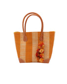 Bora Bora Saffron Two Tone Stripes Straw Basket Bag with Waterfall Pompoms Charm Embellishment handmade loomed natural raffia palm fiber in a multicolor horizontal stripe pattern of even width wide bands of saffron orange/yellow and natural straw color with leather handles and feet plus matching waterfall pompom charm embellishment handbag beach bag - Shebobo