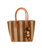 Bora Bora Tobacco Two Tone Stripes Straw Basket Bag with Waterfall Pompoms Charm Embellishment handmade loomed natural raffia palm fiber in a multicolor horizontal stripe pattern of even width wide bands of tobacco cinnamon/dark/brown and natural straw color with leather handles and feet plus matching waterfall pompom charm embellishment handbag beach bag - Shebobo