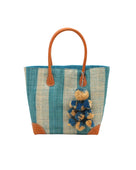 Bora Bora Turquoise Two Tone Stripes Straw Basket Bag with Waterfall Pompoms Charm Embellishment handmade loomed natural raffia palm fiber in a multicolor horizontal stripe pattern of even width wide bands of turquoise light/blue/green and natural straw color with leather handles and feet plus matching waterfall pompom charm embellishment handbag beach bag - Shebobo
