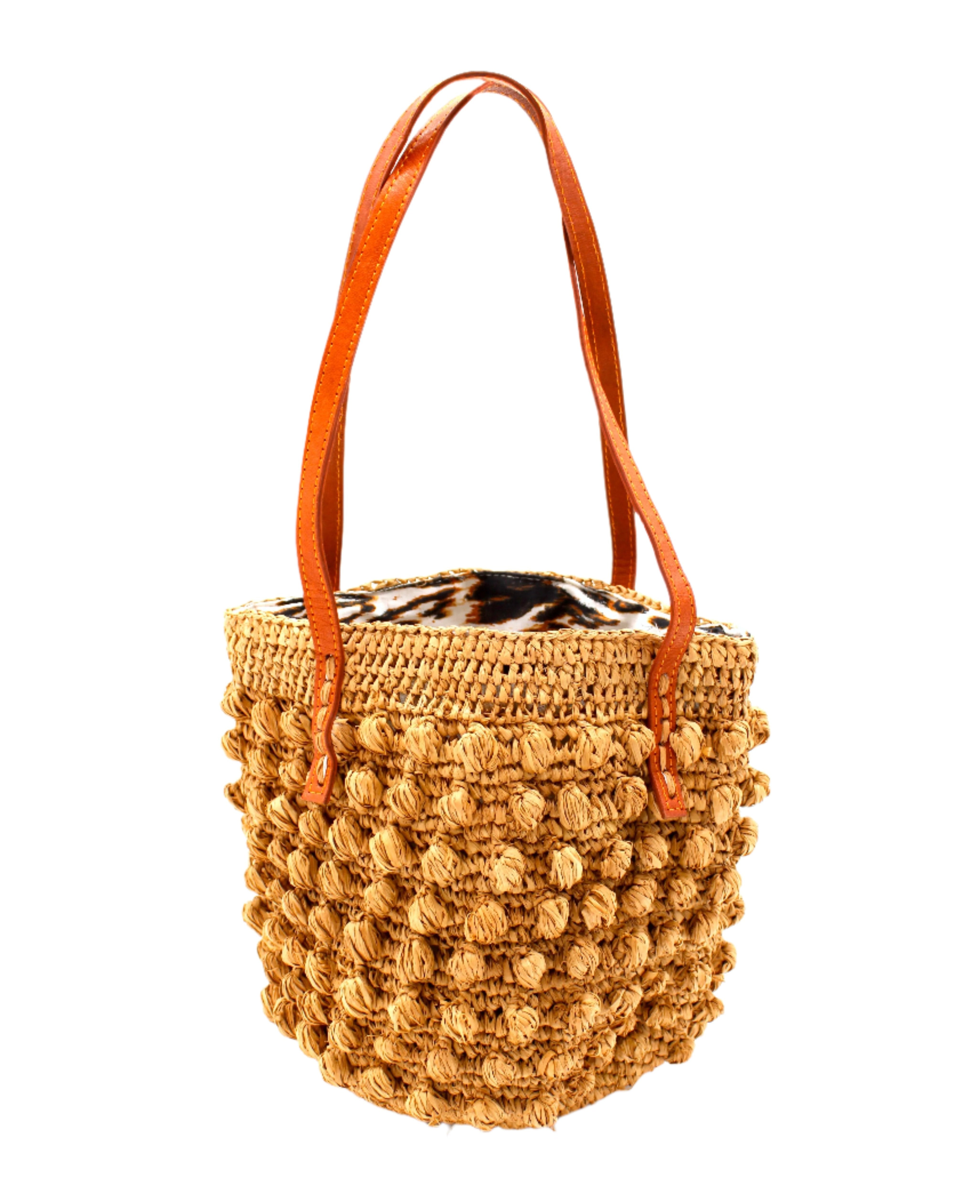 Boucle Cappuccino Crochet Small Straw Handbag  handmade woven raffia palm fiber in a solid hue of cappuccino light/brown/beige in a supple nub/ball texture of horizontal bands around the bag with link weave around the top plus assorted print drawstring liner and leather handles  shoulder bag purse - Shebobo