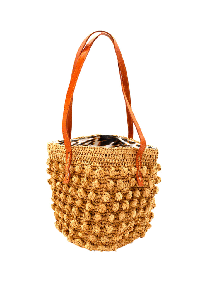 Boucle Cappuccino Crochet Small Straw Handbag  handmade woven raffia palm fiber in a solid hue of cappuccino light/brown/beige in a supple nub/ball texture of horizontal bands around the bag with link weave around the top plus assorted print drawstring liner and leather handles  shoulder bag purse - Shebobo