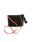 Boucle Black Crochet Straw Crossbody Bag with Tassel Charm  handmade woven raffia palm fiber in a solid hue of black in a supple nub/ball texture of horizontal bands around the bag with link weave around the outer envelope closure flap plus adjustable leather shoulder strap beach bag purse - Shebobo