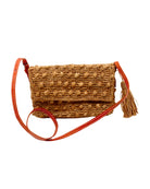 Boucle Cappuccino Crochet Straw Crossbody Bag with Tassel Charm  handmade woven raffia palm fiber in a solid hue of cappuccino light/brown/beige in a supple nub/ball texture of horizontal bands around the bag with link weave around the outer envelope closure flap plus adjustable leather shoulder strap beach bag purse - Shebobo