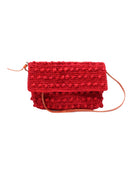 Boucle Red Crochet Straw Crossbody Bag with Tassel Charm  handmade woven raffia palm fiber in a solid hue of red in a supple nub/ball texture of horizontal bands around the bag with link weave around the outer envelope closure flap plus adjustable leather shoulder strap beach bag purse - Shebobo