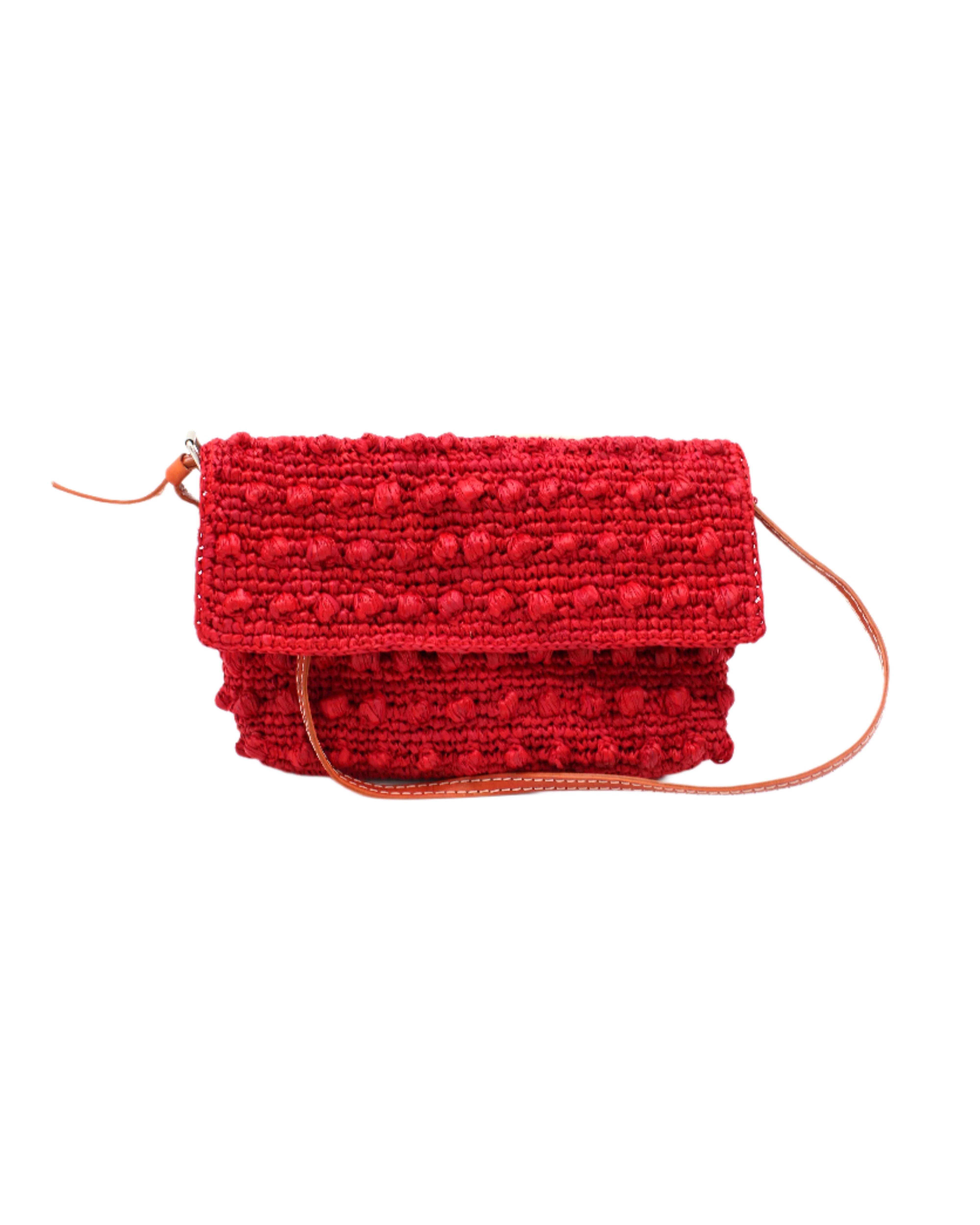 Boucle Red Crochet Straw Crossbody Bag with Tassel Charm  handmade woven raffia palm fiber in a solid hue of red in a supple nub/ball texture of horizontal bands around the bag with link weave around the outer envelope closure flap plus adjustable leather shoulder strap beach bag purse - Shebobo