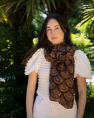 Model wearing Vegas Geometric Print with Metallic Detailing Scarf & Wrap Brown Multicolor Square Patterned Scarf - Shebobo