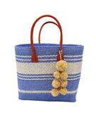 Cabrillo Sisal Basket Bag with Waterfall Pompoms Charm Embellishment handmade natural sisal fiber woven into a multicolor two tone Denim retro/light/blue and natural straw color  horizontal stripe pattern with muti-width bands of color plus leather handles and natural raffia  charm shoulder bag beach bag - Shebobo