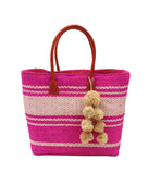 Cabrillo Sisal Basket Bag with Waterfall Pompoms Charm Embellishment handmade natural sisal fiber woven into a multicolor two tone Fuchsia hot/bright/barbie/pink and natural straw color  horizontal stripe pattern with muti-width bands of color plus leather handles and natural raffia charm shoulder bag beach bag - Shebobo
