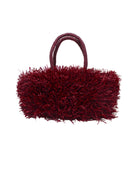Calypso Pompom Pouf Crochet Straw Basket Handbag handmade natural raffia palm fiber in a solid hue of Umberwine burgunday/bordeaux/dark/purple/red with brushed fringe strands crochet and knotted into a pouf texture with matching wrapped handles purse - Shebobo