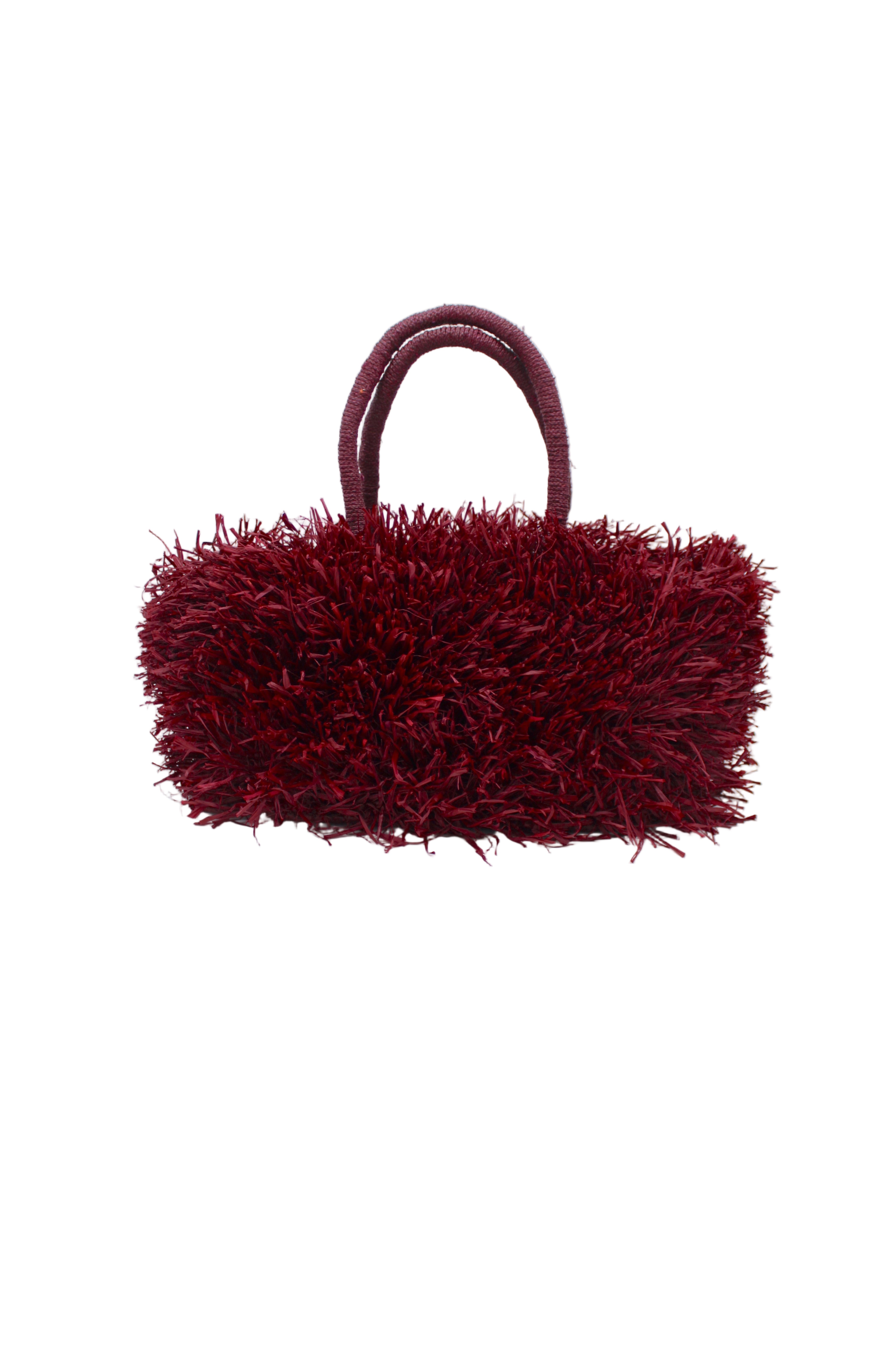 Calypso Pompom Pouf Crochet Straw Basket Handbag handmade natural raffia palm fiber in a solid hue of Umberwine burgunday/bordeaux/dark/purple/red with brushed fringe strands crochet and knotted into a pouf texture with matching wrapped handles purse - Shebobo