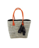 Cancun Small Sisal Basket Bag with Tassel Charm handmade natural sisal fibers woven into even width horizontal bands of black and natural straw color that create a pinstripe pattern with matching knotted raffia tufts tassel charm embellishment and leather handles beach bag - Shebobo