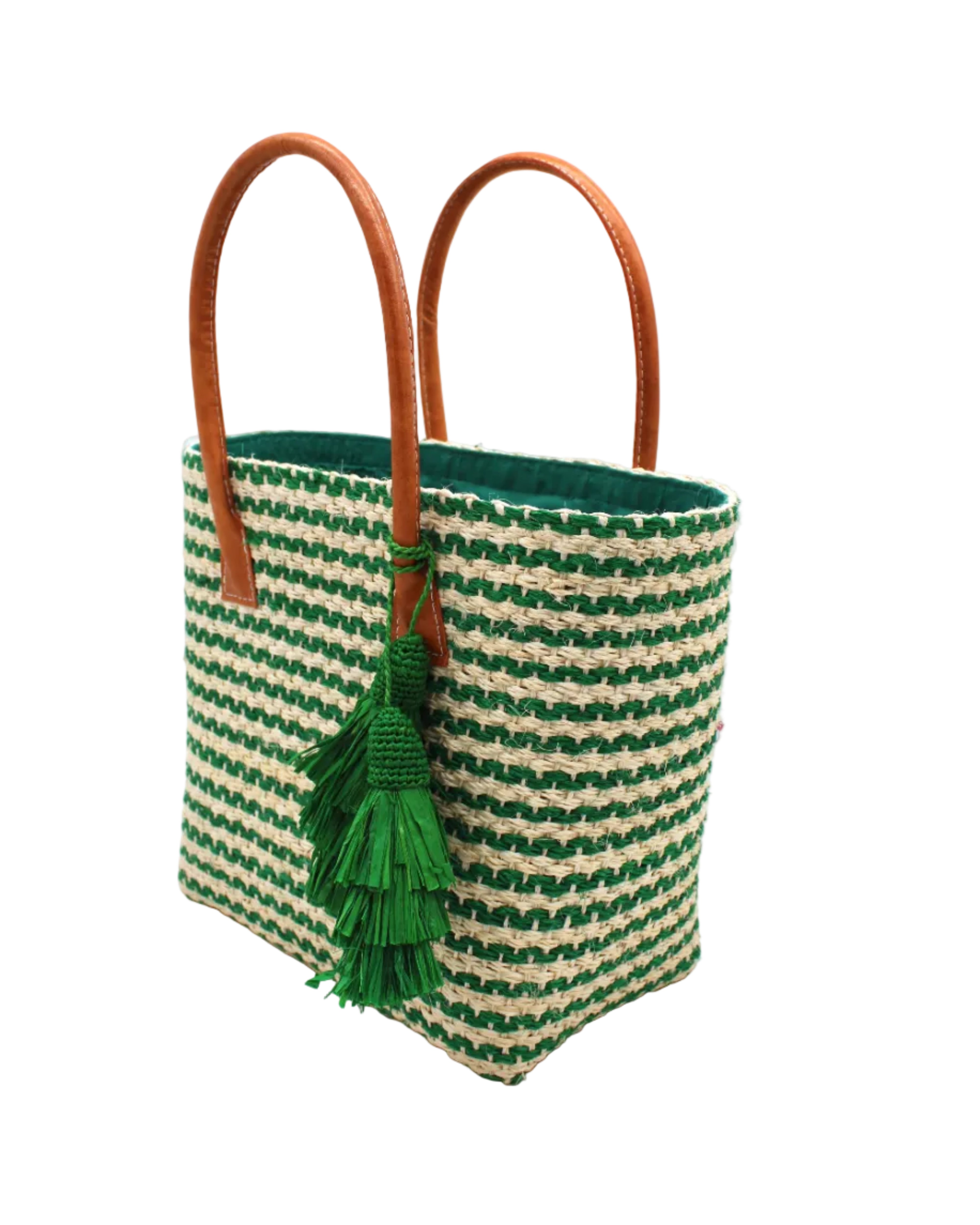 Side view Cancun Small Sisal Basket Bag with Tassel Charm handmade natural sisal fibers woven into even width horizontal bands of deep green and natural straw color that create a pinstripe pattern with matching knotted raffia tufts tassel charm embellishment and leather handles beach bag - Shebob
