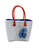 Cancun Small Sisal Basket Bag with Tassel Charm handmade natural sisal fibers woven into even width horizontal bands of denim/retro/light blue and natural straw color that create a pinstripe pattern with matching knotted raffia tufts tassel charm embellishment and leather handles beach bag - Shebob