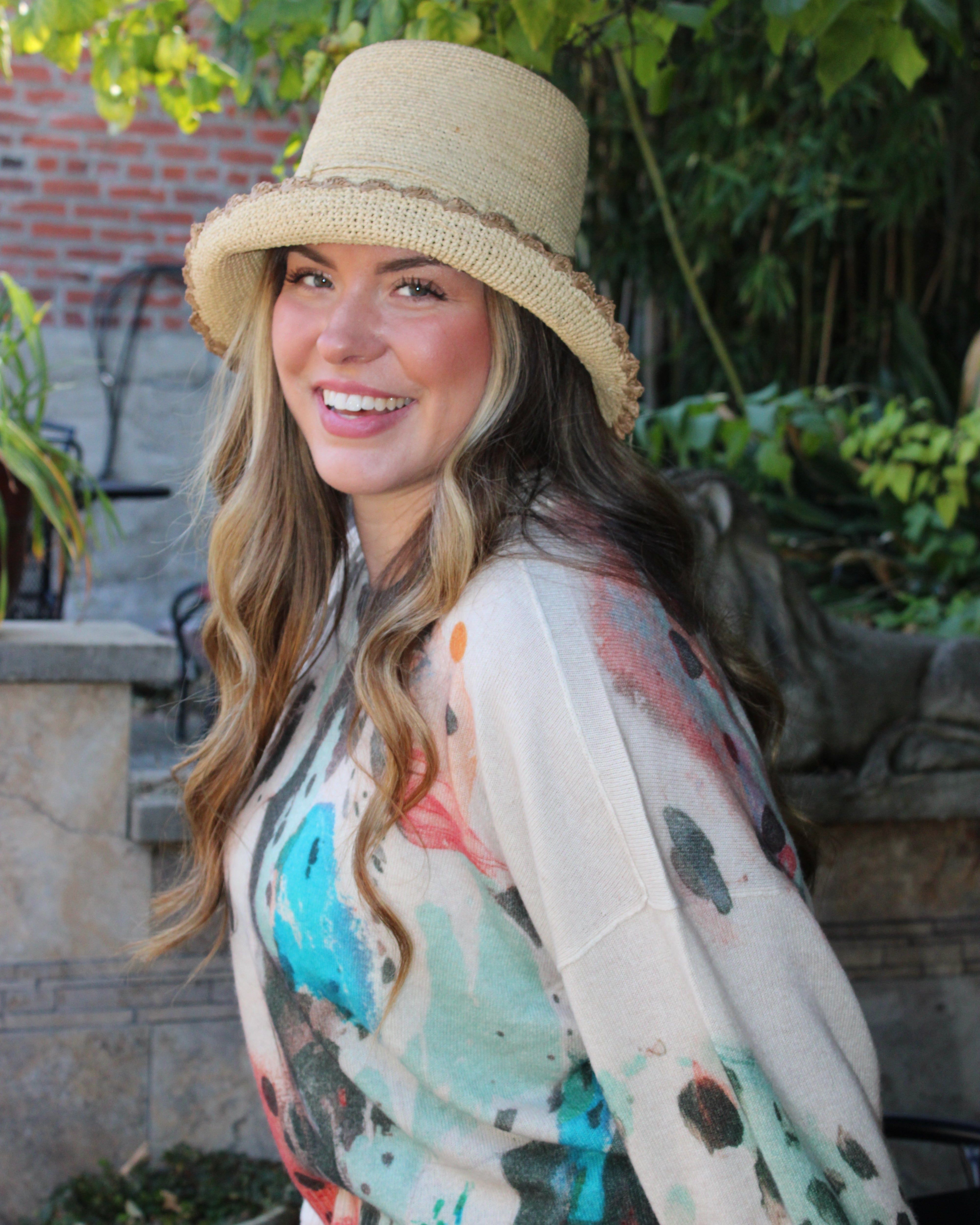 Model wearing Kate Natural with Cappuccino Crochet Bucket Straw Hats with Colored Lace Weave Edge handmade woven raffia palm fiber in a solid hue of natural straw color in a subtle link texture with cappuccino tea/light/brown lace weave floral edge trim around the outer brim two tone multicolor uv protection hat - Shebobo