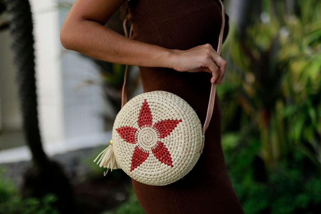 Model wearing Carmel Crochet Round Flower Crossbody bag with Tassel Assorted Flower colors with adjustable leather strap and tassel zipper pull purse - Shebobo