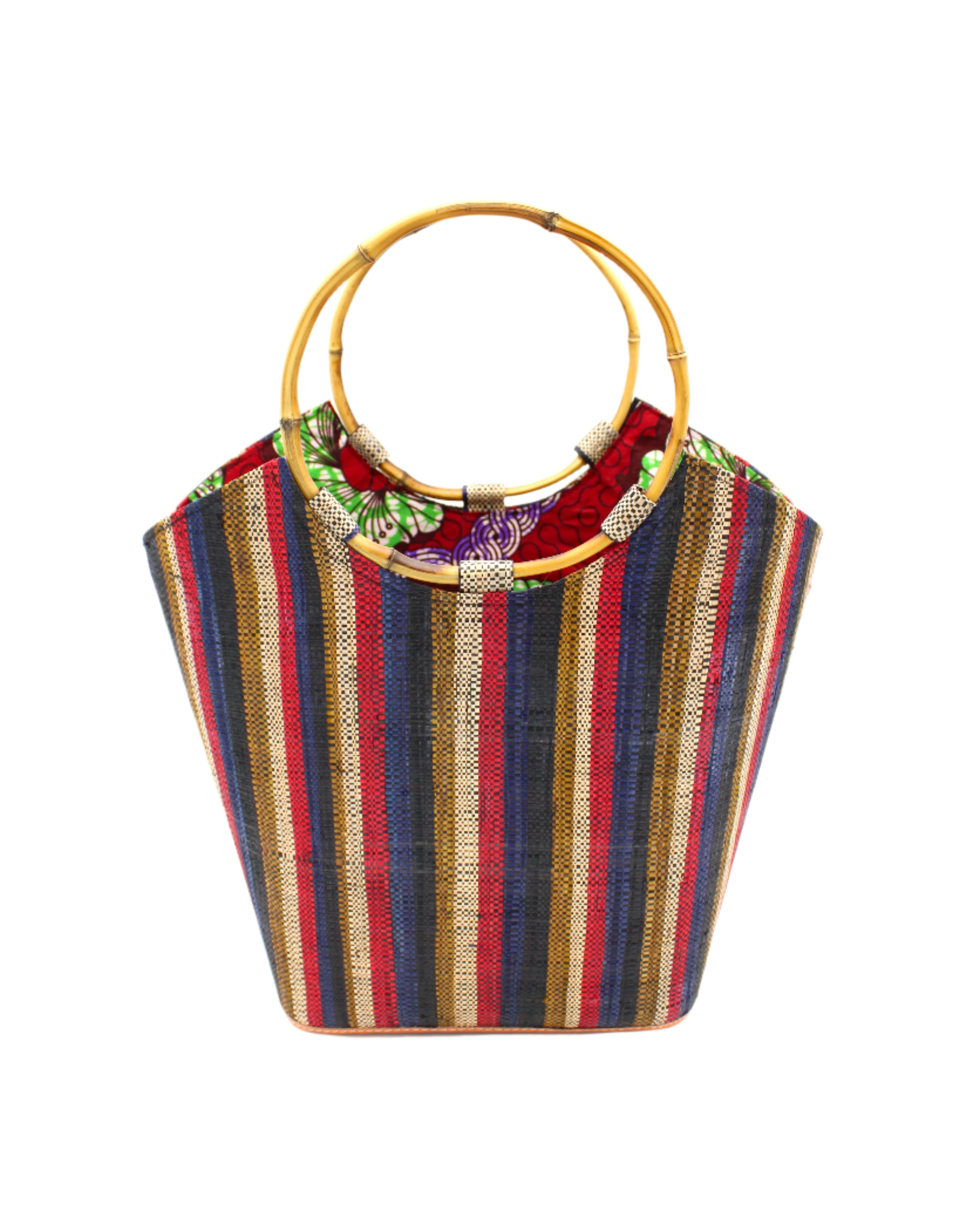 Carmen Solid/Stripes Straw Bucket Bag with Bamboo Handles Dark and Moody multicolor vertical stripe pattern of brown, red, blue, natural, and black with assorted liner purse - Shebobo