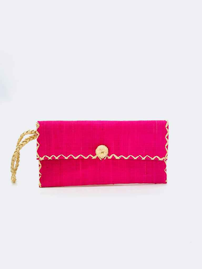 ChiChi Fuchsia Straw Clutch Bag handmade loomed raffia palm fiber wristlet in fuchsia pink color with natural straw color cross stitch edging, button & loop closure, and braided wrist strap - Shebobo