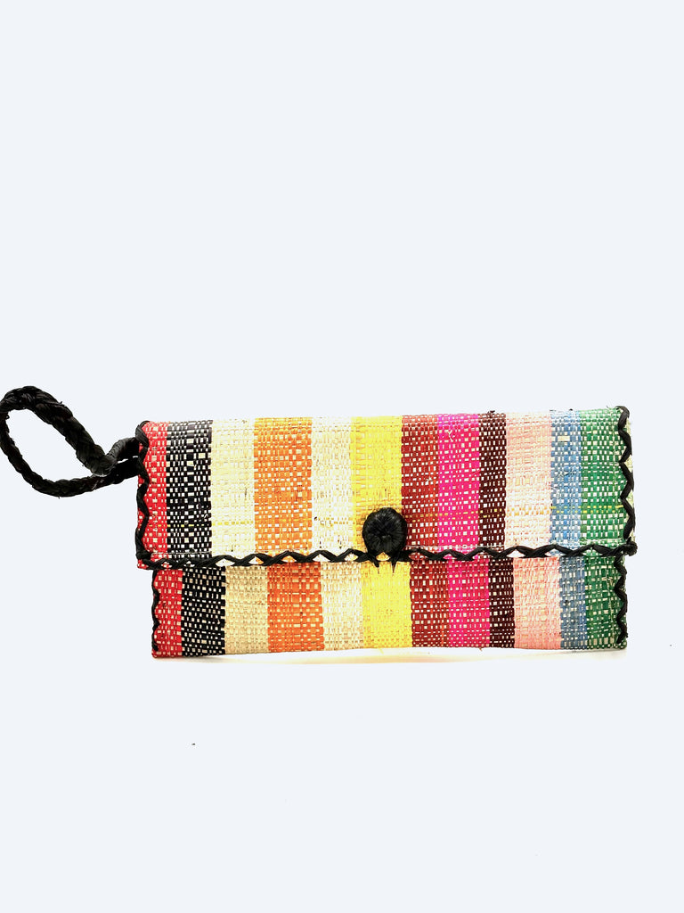 ChiChi Lollipop Stripe Multicolor Straw Clutch Bag handmade loomed raffia palm fiber wristlet in multi-width bands of turquoise blue, saffron yellow, blue, natural, fuchsia pink, green, black, coral orange/red, etc. that create a vertical stripe pattern with black color cross stitch edging, button & loop closure, and braided wrist strap - Shebobo
