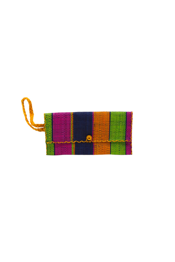 ChiChi Caribbean Swirl Multicolor Straw Clutch Bag handmade loomed raffia palm fiber wristlet in multi-width bands of dark blue, lime green, saffron yellow, and fuchsia pink that create a vertical stripe pattern with saffron color cross stitch edging, button & loop closure, and braided wrist strap - Shebobo