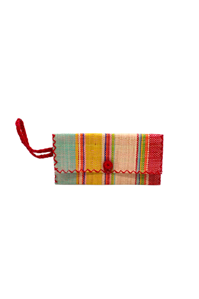 ChiChi Raspberry Swirl Multicolor Straw Clutch Bag handmade loomed raffia palm fiber wristlet in multi-width bands of light blue, light/baby pink, saffron orange/yellow, red, lime green, natural straw color, dark blue, and fuchsia pink that create a vertical stripe pattern with red color cross stitch edging, button & loop closure, and braided wrist strap - Shebobo