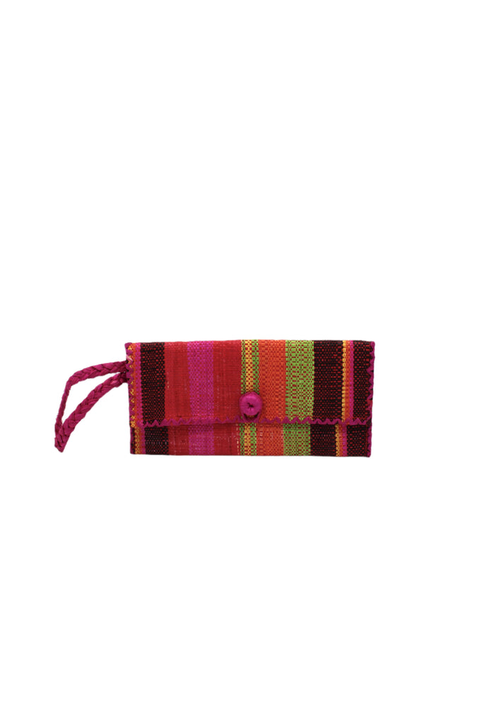 ChiChi Watermelon Swirl Multicolor Straw Clutch Bag handmade loomed raffia palm fiber wristlet in multi-width bands of black, yellow, lime green, red, orange, and fuchsia pink that create a vertical stripe pattern with fuchsia color cross stitch edging, button & loop closure, and braided wrist strap - Shebobo