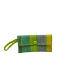 ChiChi Izarra Swirl Multicolor Straw Clutch Bag handmade loomed raffia palm fiber wristlet in multi-width bands of yellow, teal  dark/blue/green, denim retro/light/blue, midori lime/bright/neon/green, turquoise blue/green, dusk navy/dark/blue that create a vertical stripe pattern with teal color cross stitch edging, button & loop closure, and braided wrist strap - Shebobo