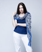 Model wearing Cleo Snake Print Scarf Wrap Dusk Blue, Black, and White Multicolor Snake Skin Patterned Scarf with colored edge - Shebobo
