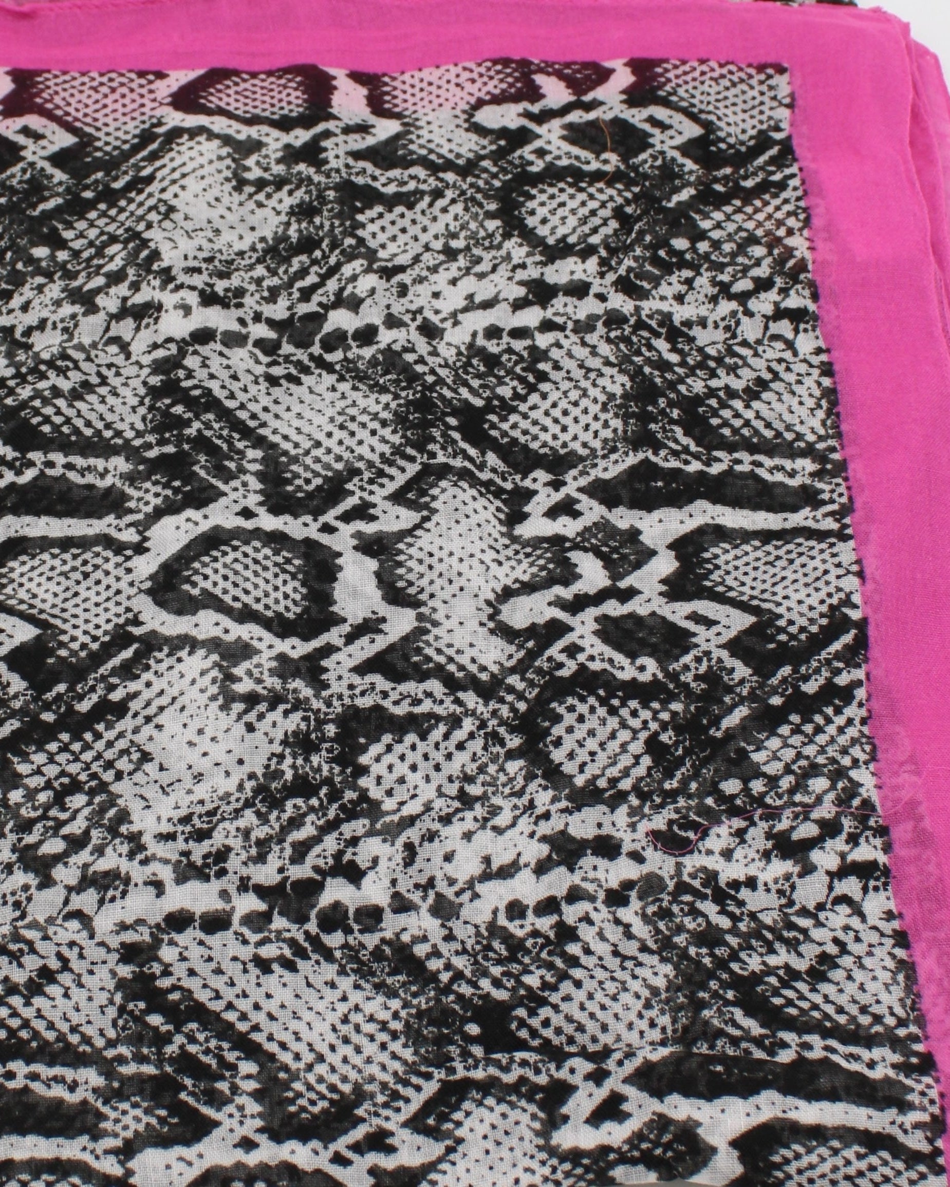 Detail view of pattern Cleo Snake Print Scarf Wrap Fuchsia Pink, Black, and White Multicolor Snake Skin Patterned Scarf with colored edge - Shebobo