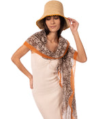 Model wearing Cleo Snake Print Scarf Wrap Coral Orange, Black, and White Multicolor Snake Skin Patterned Scarf with colored edge - Shebobo (with Kate 3" Brim Crochet Bucket Straw Sun Hats)