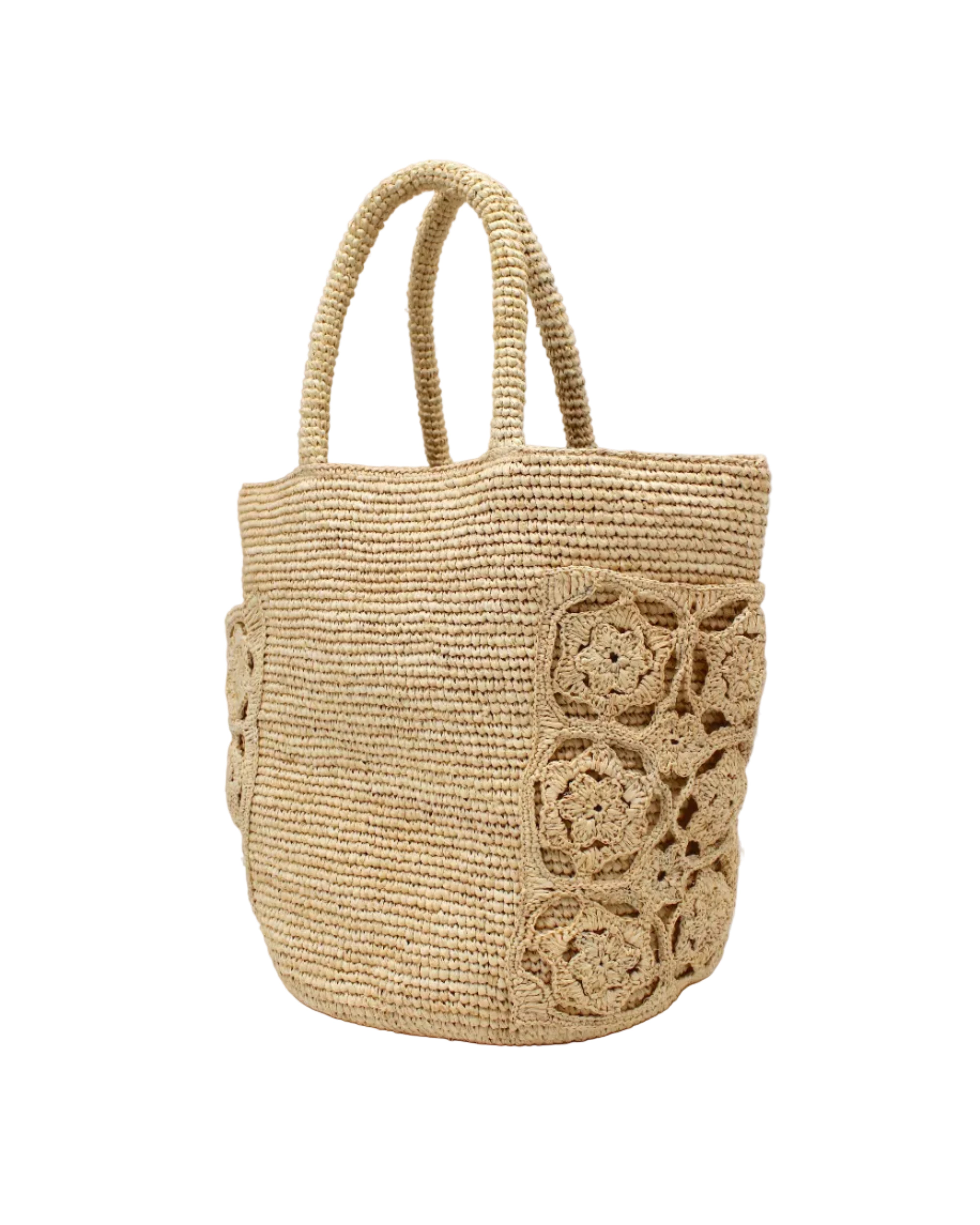 Side view Colette FlowerCrochet Straw Basket Handbag with Pockets handmade natural raffia palm fiber in a solid hue of natural straw color with geometric granny square floral cutout pattern on two large external pockets tote bag - Shebobo