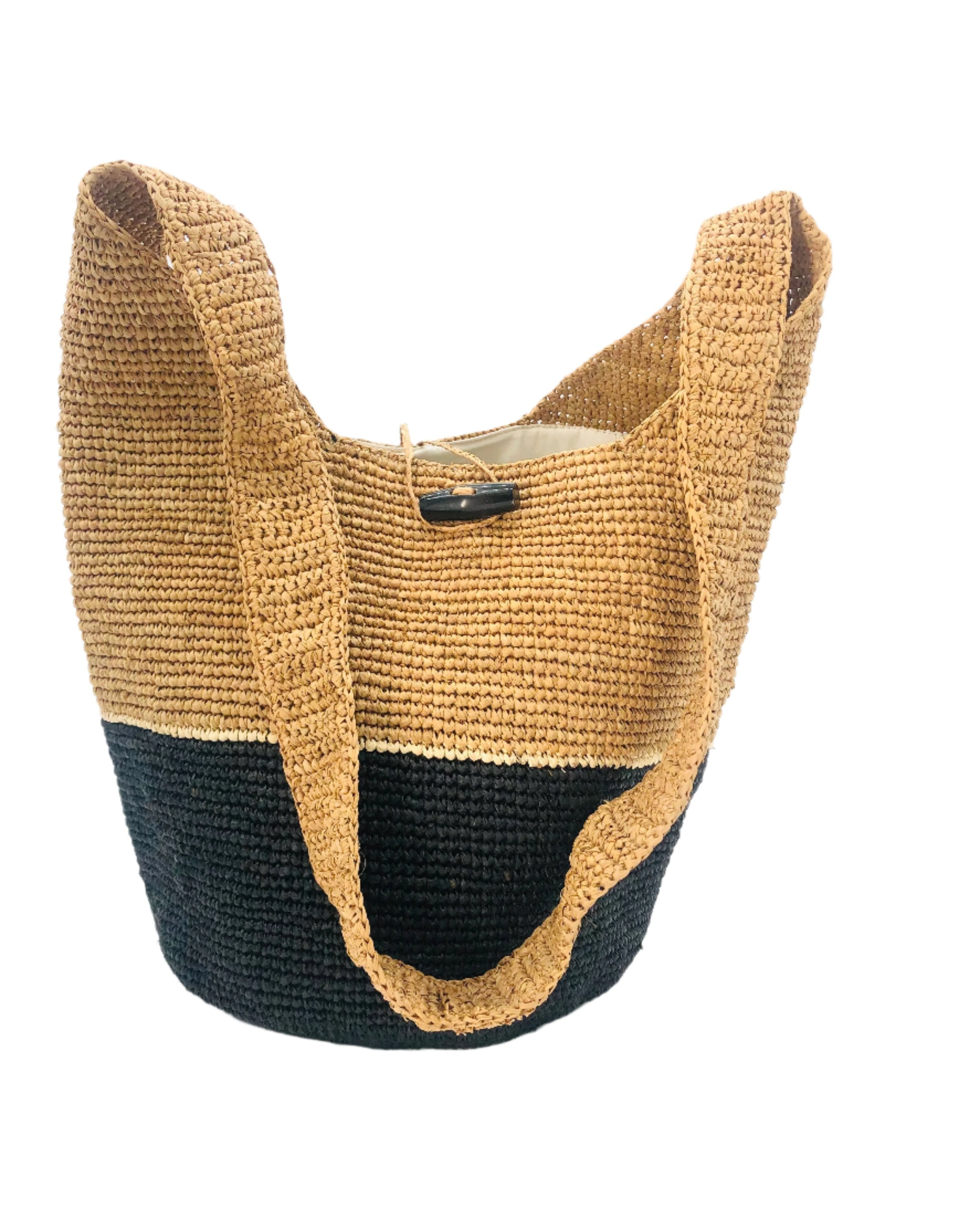 Coronado Two Tone Crochet Crossbody Bag handmade with interior liner, horn button and loop closure raffia purse black bottom, with narrow natural straw color horizontal stripe separating light brown/tea colored top & shoulder strap - Shebobo
