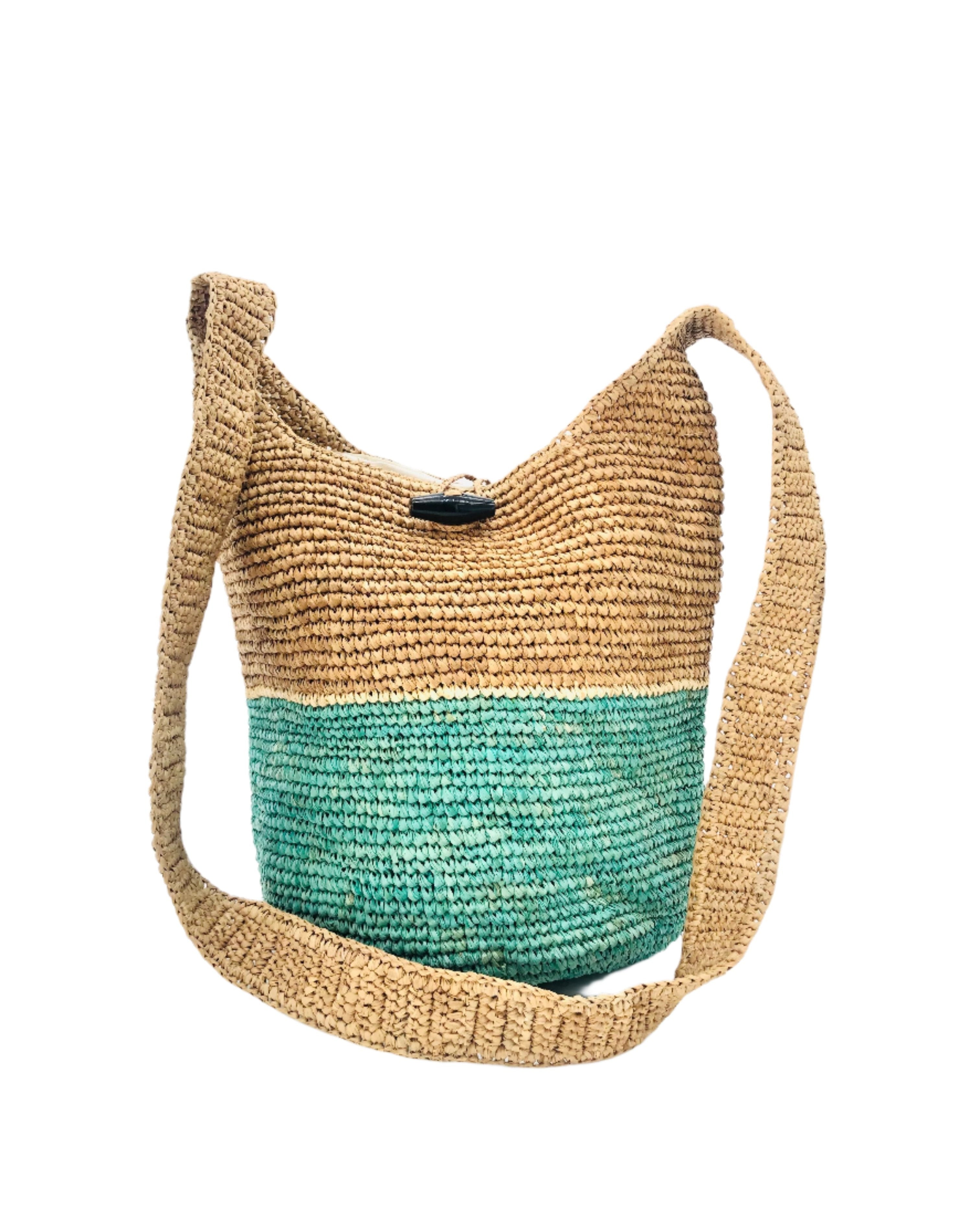 Coronado Two Tone Crochet Crossbody Bag handmade with interior liner, horn button and loop closure raffia purse seafoam/light turquoise greenish blue/teal bottom, with narrow natural straw color horizontal stripe separating light brown/tea colored top & shoulder strap - Shebobo