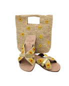 Daisy Crochet Straw & Leather Sandal with Flower Embroidery & Metallic Detailing handmade crochet natural raffia palm fiber in a solid hue of natural straw color in two bands with saffron yellow petals and coral orange/red centered embroidered flower pattern wrap around the top  of the shoe with a band of metallic gold across the top summer sandals shoes - Shebobo (with Mini Concon Flower Embroidery Straw Basket Purse)