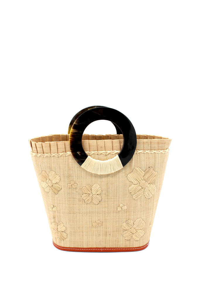 Daisy Straw Bucket Bag with Flower Embroidery and Horn Handle Natural Purse with Ruffle Edge handmade loomed raffia palm fiber in a solid hue of natural straw color with matching subtle hand embroidered floral pattern with multiple sized flowers and raffia ruffle on the opening  handbag - Shebobo