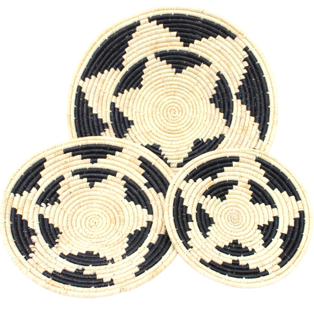 Dakarai Raffia Straw Wall Decor Display Basket Tray: Set of 3 handmade woven natural raffia palm fiber in a crochet loop technique concentric coiled circular pattern with double natural straw color and black centered star flower pattern set of three sized flat bowl trays - Shebobo