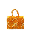 Gemma Crochet Disc Rectangle Saffron and Butter Straw Basket Handbag handmade woven raffia palm fiber in a two tone multicolor pattern of saffron yellow/orange and butter light yellow create a coiled braid disc pattern result in a star pattern around the bag with matching woven handles top handle bag - Shebobo