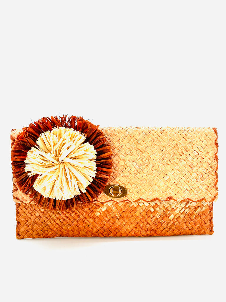 Holden Ombre Caramel Straw Clutch with Flower Pouf handmade woven raffia dip dyed gradient of Blush orange/pink, natural, caramel brown with large caramel and natural fringe flower embellishment - Shebobo