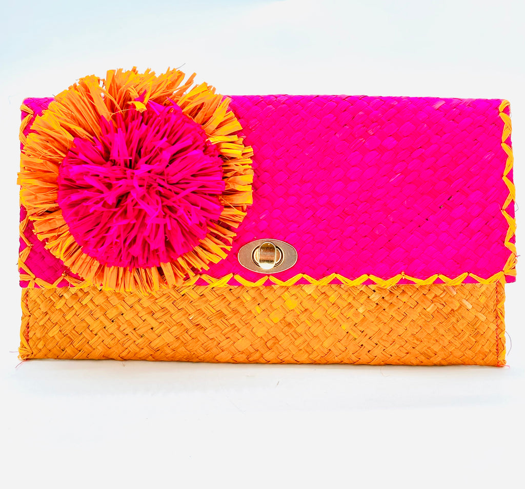Holden Ombre Fuchsia Straw Clutch with Flower Pouf handmade woven raffia dip dyed gradient of fuchsia bright/barbie/pink, saffron yellow, and coral orange/red with large coral and fuchsia fringe flower embellishment - Shebobo