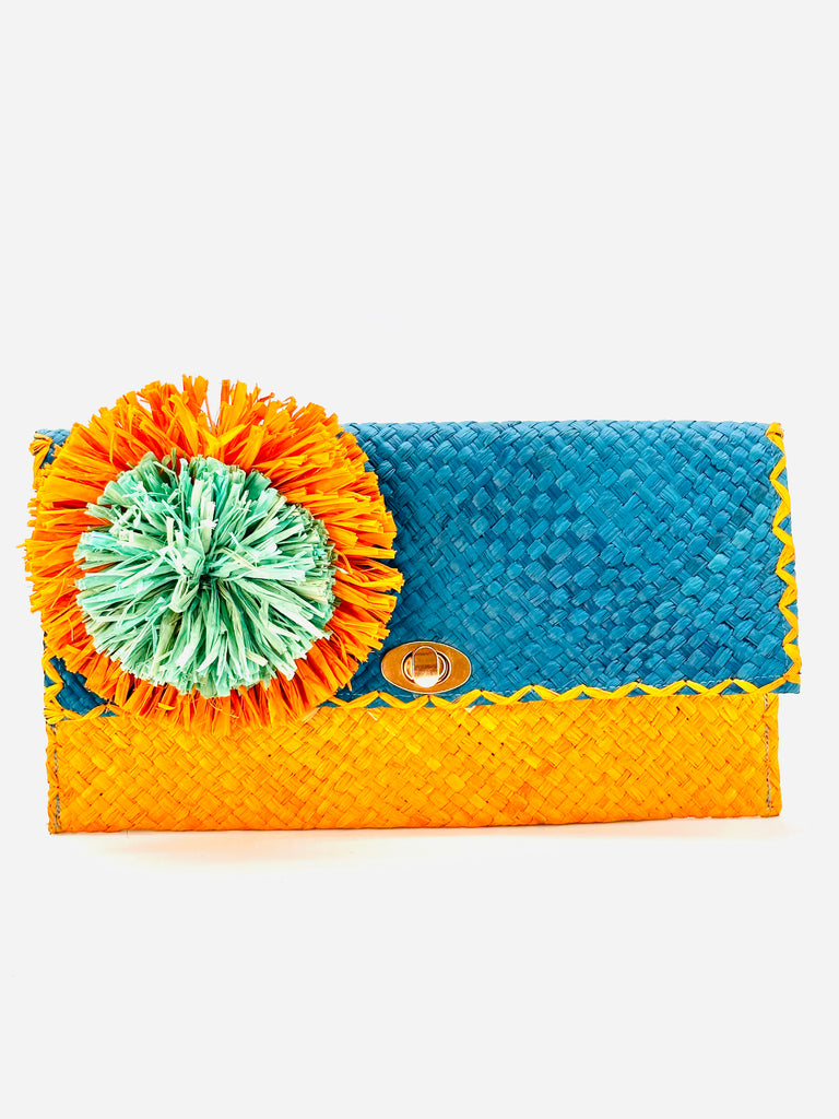 Holden Ombre Turquoise Straw Clutch with Flower Pouf handmade woven raffia dip dyed gradient of turquoise blue, seafoam blue/green, and saffron yellow with large saffron and seafoam fringe flower embellishment - Shebobo