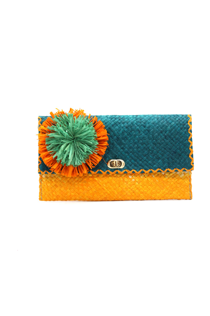 Holden Ombre Turquoise Straw Clutch with Flower Pouf handmade woven raffia dip dyed gradient of turquoise blue, seafoam blue/green, and saffron yellow with large saffron and seafoam fringe flower embellishment - Shebobo