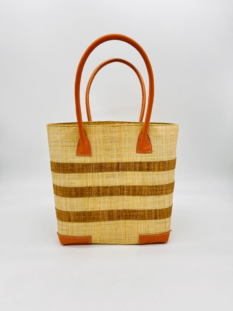 Jacky Natural Small Straw Basket Bag handmade loomed raffia palm fiber in natural straw color with three centered horizontal stripes of tobacco/cinnamon/brown handbag purse with leather handles and detailing - Shebobo
