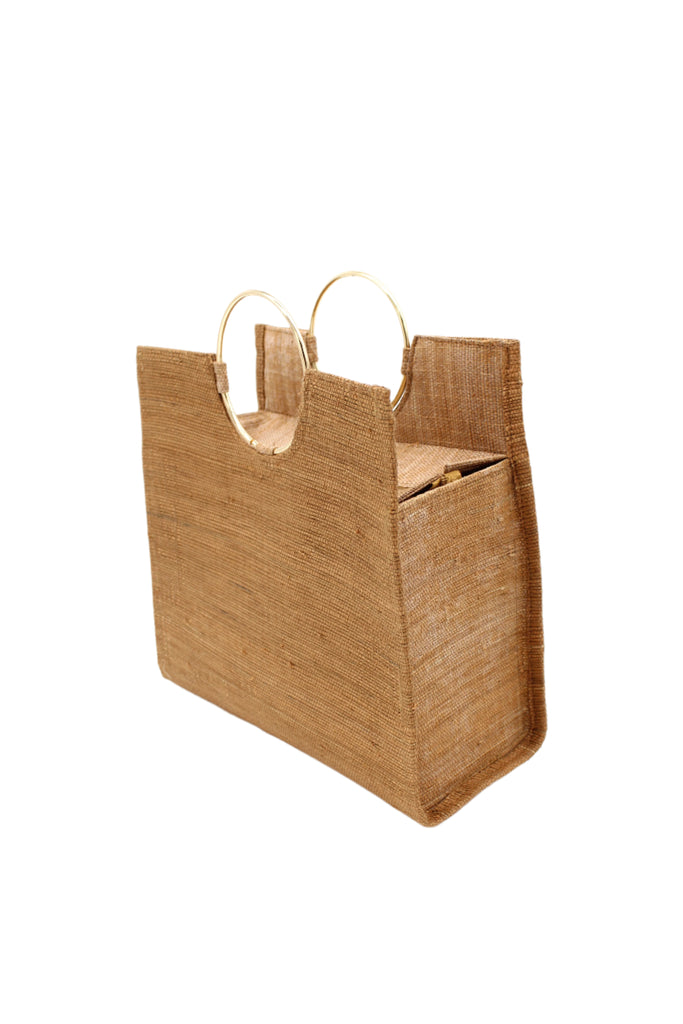 Side view JoJo Woven Straw Handbag with Metal Ring Handle handmade natural raffia palm fiber in a solid hue of Cappuccino tea/light/brown with matching woven thread texture and metallic circular metal ring handle - Shebobo