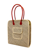 Side view Josephine 50's Inspired Woven Straw Handbag handmade natural raffia palm fiber in natural straw color woven with contrasting Black thread stitching in a subtle diagonal stripe pattern consisting of bands of ovals and circles with loomed raffia edging around the bag as well as the pocket and flap of the exterior pocket - Shebobo