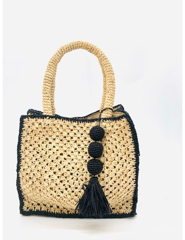 Kimba handmade crochet two tone handbag purse natural straw color with black trim and crochet cascading balls plus tassel bag charm embellishment - Shebobo