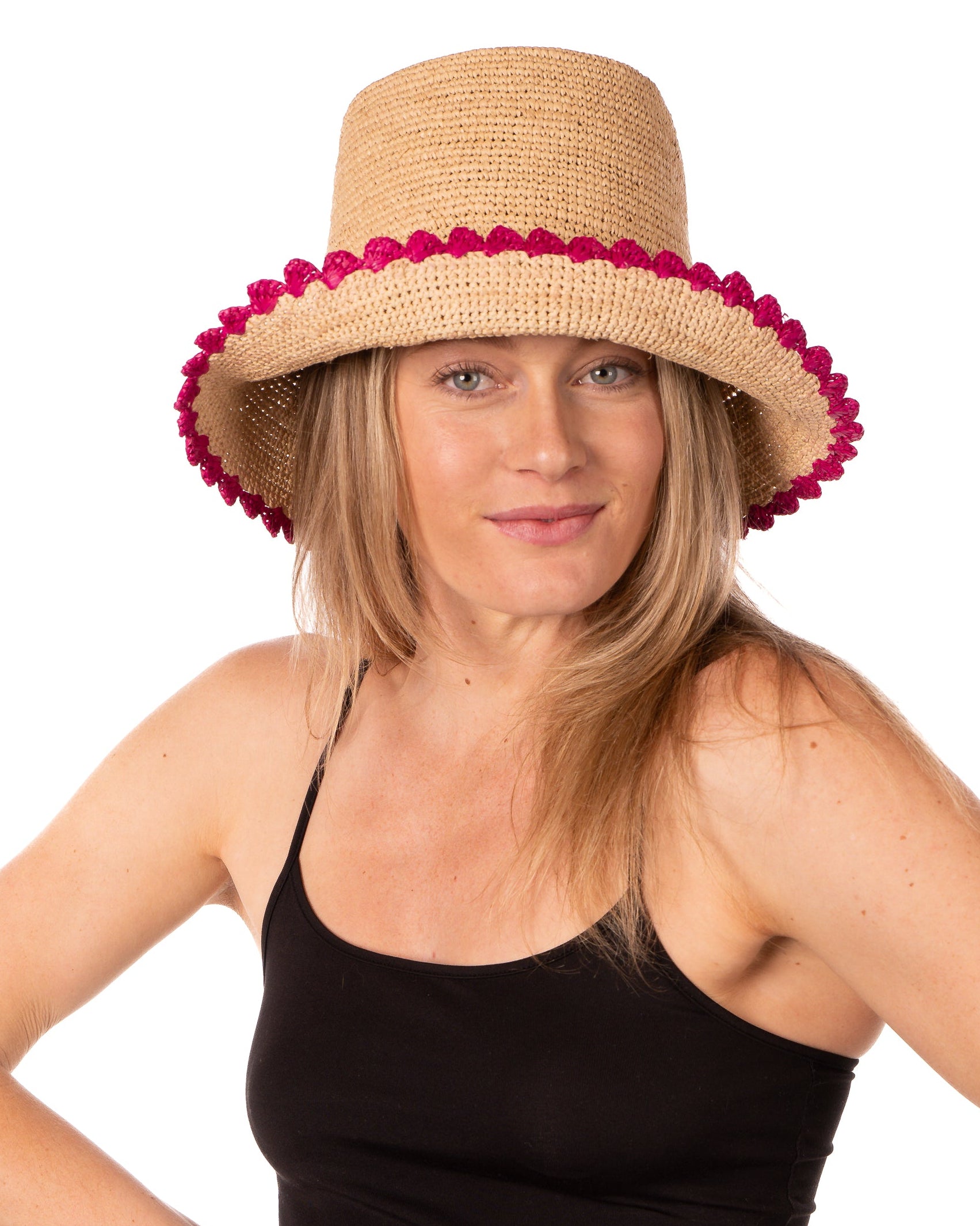 Model wearing Kate Natural with Fuchsia Crochet Bucket Straw Hats with Colored Lace Weave Edge handmade woven raffia palm fiber in a solid hue of natural straw color in a subtle link texture with fuchsia hot/bright/barbie/pink lace weave floral edge trim around the outer brim two tone multicolor uv protection hat - Shebobo