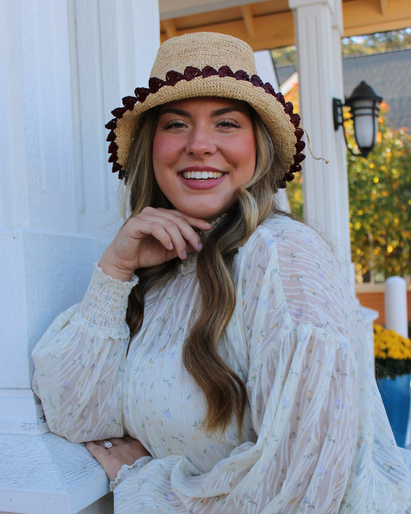 Model wearing Kate Natural with Umberwine Crochet Bucket Straw Hats with Colored Lace Weave Edge handmade woven raffia palm fiber in a solid hue of natural straw color in a subtle link texture with umberwine bordeaux/claret/deep/dark/red/purple lace weave floral edge trim around the outer brim two tone multicolor uv protection hat - Shebobo