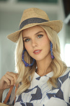 Model wearing Kelly Crochet Fedora - Unisex Straw Sun Hats handmade woven natural raffia palm fiber in a solid hue of natural straw color with woven in hatband of  grey - Shebobo