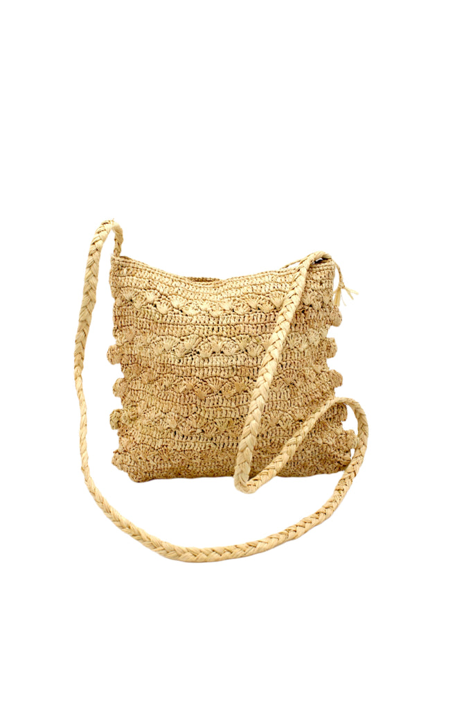 Kristen Crochet Straw Crossbody Bag with Nub Edge handmade crochet natural raffia palm fiber in a solid hue of natural straw color with two textures of fans and links that create a horizontal stripe pattern across the bag with braided shoulder strap and crochet nub edging along the vertical sides of the purse - Shebobo